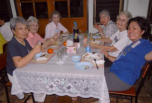 A table of sisters at supper